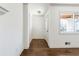 Bright foyer with hardwood floors, white walls, and a door leading to the main living area at 5051 Heather Se Rd, Smyrna, GA 30082