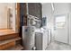 Laundry room with washer, dryer, water heater, and exterior access at 5051 Heather Se Rd, Smyrna, GA 30082
