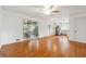 Open-concept living area with hardwood floors, sliding glass doors to the back, and view of the kitchen at 5051 Heather Se Rd, Smyrna, GA 30082