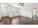 Large living area with gleaming hardwood floors, white walls, entry door, and hallway access at 5051 Heather Se Rd, Smyrna, GA 30082