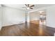 Spacious living room with gleaming hardwood floors, ceiling fan, and an open concept layout at 5051 Heather Se Rd, Smyrna, GA 30082