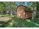 Wooden storage shed in backyard surrounded by greenery at 5051 Heather Se Rd, Smyrna, GA 30082