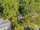 Aerial view of the house nestled among trees, showing the roof and driveway at 5051 Heather Se Rd, Smyrna, GA 30082