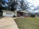 Brick ranch house with a one car garage and a well-manicured lawn at 1685 Pheasant Dr, Jonesboro, GA 30238