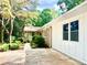 Home's side with mature trees and shrubs at 246 Plantation Sw Rd, Smyrna, GA 30082