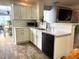 Modern kitchen with white cabinets, quartz countertops, and tile backsplash at 345 Meadows Ln, Canton, GA 30114