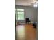 Bedroom with wood-look floors and a window at 345 Meadows Ln, Canton, GA 30114