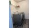 Laundry room with washer, dryer, and shelving at 345 Meadows Ln, Canton, GA 30114