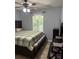 Spacious bedroom with a large bed, window, and ceiling fan at 345 Meadows Ln, Canton, GA 30114