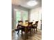 Cozy dining area with wood table and chairs, near sliding glass doors at 345 Meadows Ln, Canton, GA 30114