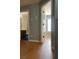 Hallway with wood-look flooring and access to bathroom and bedroom at 345 Meadows Ln, Canton, GA 30114