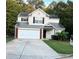 Two-story house with attached garage at 345 Meadows Ln, Canton, GA 30114