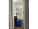 Small bathroom with tub and wood-look flooring at 345 Meadows Ln, Canton, GA 30114