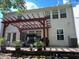 Home's backyard features a pergola, patio, and lush landscaping at 345 Meadows Ln, Canton, GA 30114