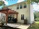 Home's backyard features a pergola, patio, and lush landscaping at 345 Meadows Ln, Canton, GA 30114