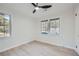 Bright bedroom with two windows and light wood flooring at 2975 Rollingwood Se Ln, Atlanta, GA 30316