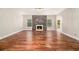 Spacious living room with hardwood floors and a stone fireplace at 2725 Palmview Sw Ct, Atlanta, GA 30331