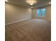 Spacious carpeted bedroom with large window offering natural light at 3305 Cranston Ln, Kennesaw, GA 30144