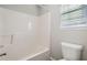 Clean bathroom with tub shower combo and vinyl flooring at 3306 Summer Brooke Ln, Union City, GA 30291