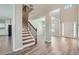 Bright and airy entryway with staircase and wood-look flooring at 3306 Summer Brooke Ln, Union City, GA 30291