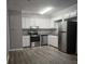 Modern kitchen featuring stainless steel appliances and granite countertops at 255 Bellwood Ln, Riverdale, GA 30274