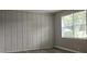 Living room with wood-look flooring and wainscoting at 255 Bellwood Ln, Riverdale, GA 30274