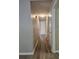 Bright hallway with light gray walls and wood-look flooring at 255 Bellwood Ln, Riverdale, GA 30274