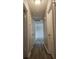 Hallway with light walls and wood-look flooring at 255 Bellwood Ln, Riverdale, GA 30274