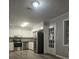 Kitchen with stainless steel appliances and white cabinets at 255 Bellwood Ln, Riverdale, GA 30274