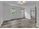 Spacious finished basement with grey vinyl flooring at 3126 Crestmont Nw Way, Kennesaw, GA 30152