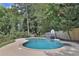 Kidney shaped swimming pool with a basketball goal at 3126 Crestmont Nw Way, Kennesaw, GA 30152