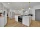 Updated kitchen with stainless steel appliances, white cabinetry, and an expansive island at 3126 Crestmont Nw Way, Kennesaw, GA 30152