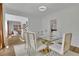 Bright dining room with a glass table, gold chairs, and hardwood floors at 3126 Crestmont Nw Way, Kennesaw, GA 30152