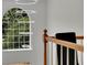 Elegant landing with a crystal chandelier and a view to the backyard at 3126 Crestmont Nw Way, Kennesaw, GA 30152