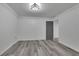 Finished basement room with grey vinyl flooring and door at 3126 Crestmont Nw Way, Kennesaw, GA 30152