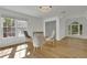 Breakfast area with glass table and gray upholstered chairs at 3126 Crestmont Nw Way, Kennesaw, GA 30152