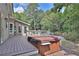 Deck with hot tub, overlooks the pool and wooded area at 3126 Crestmont Nw Way, Kennesaw, GA 30152