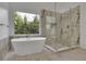Luxurious bathroom with marble finishes, soaking tub, and walk-in shower at 3126 Crestmont Nw Way, Kennesaw, GA 30152