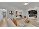 Bright living room with hardwood floors, fireplace and large TV at 3126 Crestmont Nw Way, Kennesaw, GA 30152