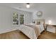Light and airy bedroom featuring hardwood floors and ample natural light at 3126 Crestmont Nw Way, Kennesaw, GA 30152