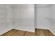 Large walk-in closet with ample shelving for storage at 3126 Crestmont Nw Way, Kennesaw, GA 30152