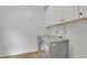 Laundry room with washer, dryer and upper cabinets at 3126 Crestmont Nw Way, Kennesaw, GA 30152