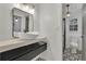 Modern bathroom with floating vanity, contemporary lighting, and geometric tile at 3126 Crestmont Nw Way, Kennesaw, GA 30152