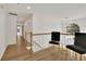 Upstairs hallway with hardwood floors and view of a large window at 3126 Crestmont Nw Way, Kennesaw, GA 30152