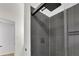Modern shower with rainfall shower head and dark gray tile at 3126 Crestmont Nw Way, Kennesaw, GA 30152