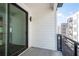 Private balcony with sliding glass door and metal railing, overlooking the community at 392 Pratt Se Dr # 2012, Atlanta, GA 30315