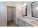 Elegant bathroom with double vanity, quartz countertop, and a built-in closet at 392 Pratt Se Dr # 2012, Atlanta, GA 30315