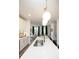 Modern kitchen with white cabinets, quartz countertops, and a large island at 392 Pratt Se Dr # 2012, Atlanta, GA 30315