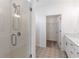Modern bathroom with a glass shower, patterned flooring, and a built-in closet at 392 Pratt Se Dr # 2012, Atlanta, GA 30315