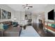 Open concept living room with hardwood floors and kitchen access at 3621 Vinings Slope Se # 3411, Atlanta, GA 30339